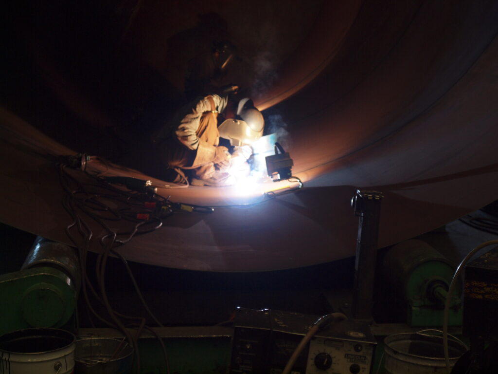 LMG Employee Welding a Tank, Demonstrating our Expertise in Tank Repair and Modification Services