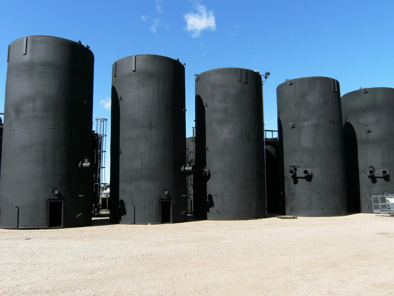 Row of Insulated Steel Storage Tanks, Showcasing LMG's Impressive Manufacturing Capacity