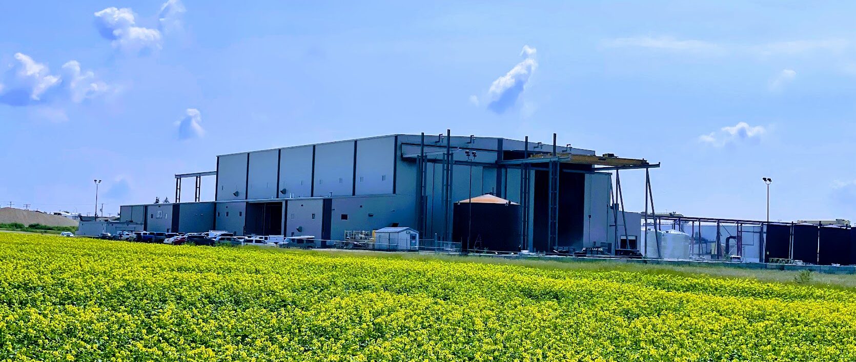 Exterior View of LMG's Battleford Facility, Designed for Fabricating Large Steel Storage Tanks with Expanded Capabilities for Wider Loads.