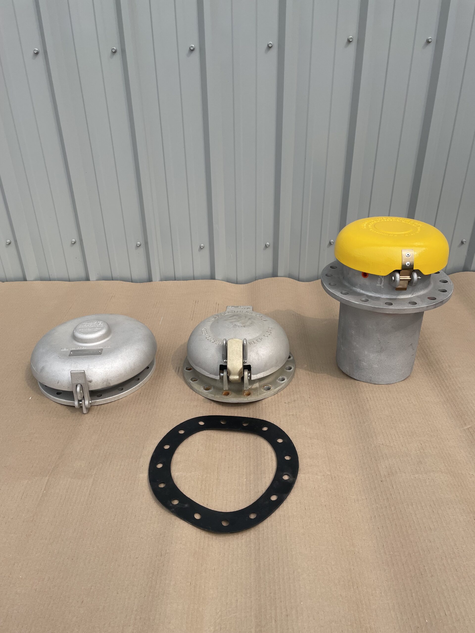 Thief hatches designed for secure access and pressure control in industrial storage tanks.