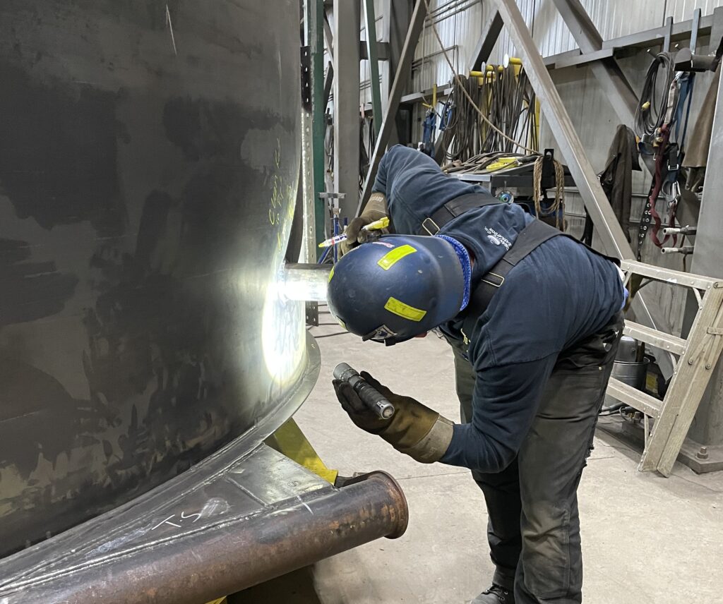 LMG Inspector Examining a Weld, Highlighting our Thorough Inspection and Quality Assurance Processes